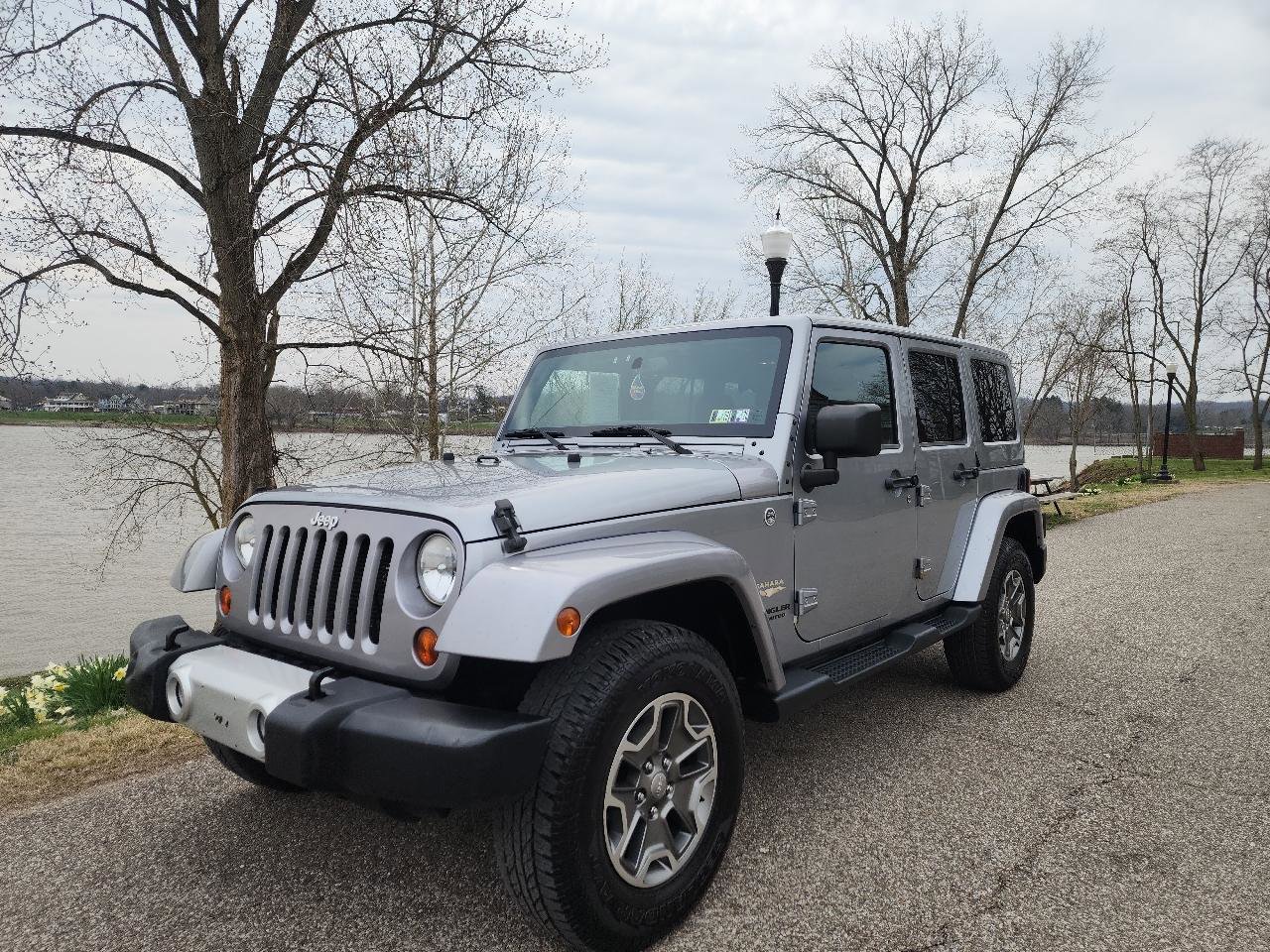 Used 2013 Jeep Wrangler Unlimited Sahara w/ Dual Top Group AWD/4WD image 1