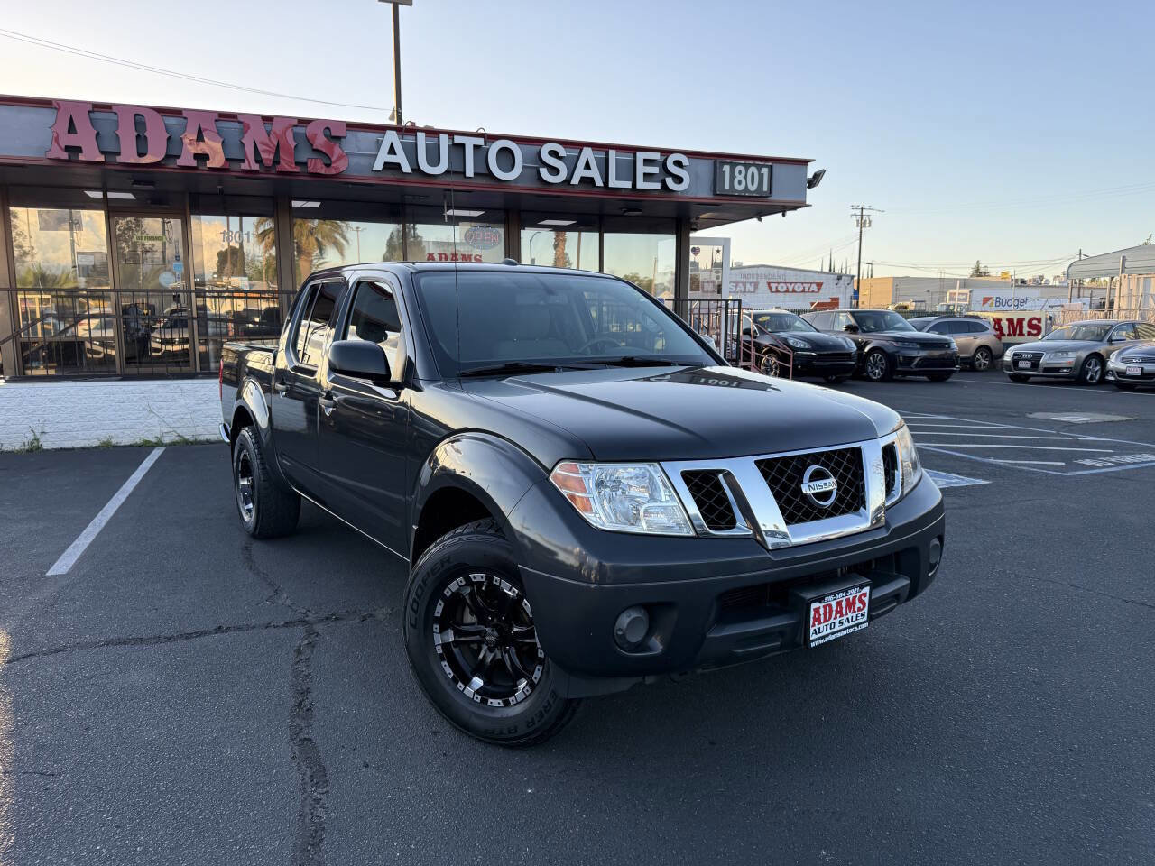 Used 2012 Nissan Frontier SV w/ SV Premium Utility Pkg AWD/4WD image 1