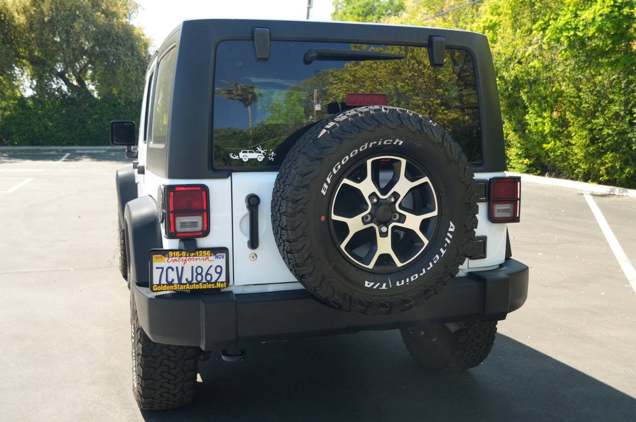 Used 2014 Jeep Wrangler Unlimited Sport w/ Mopar Black Appearance Group AWD/4WD image 6