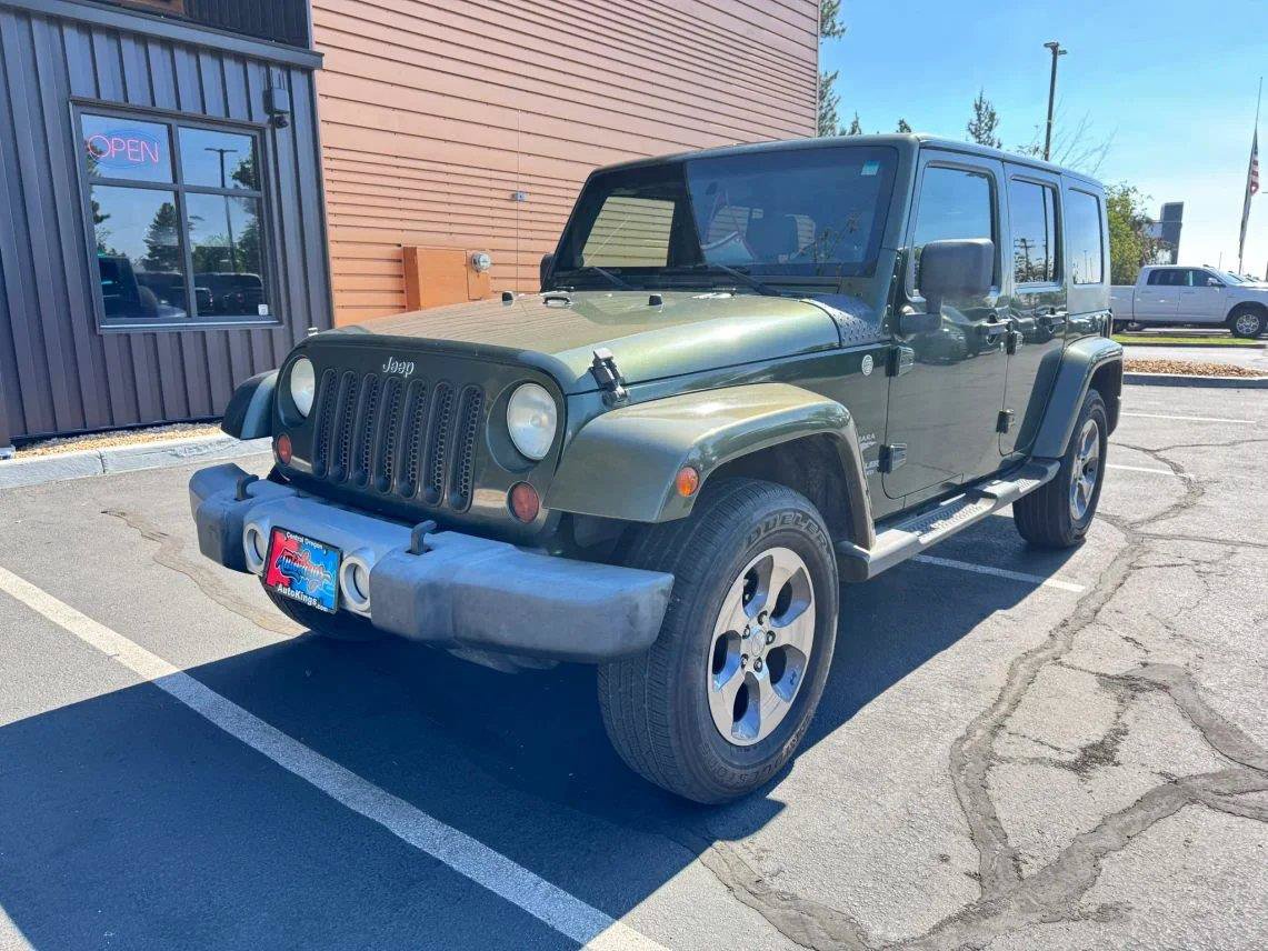 Used 2009 Jeep Wrangler Unlimited Sahara w/ Dual Top Group AWD/4WD image 1