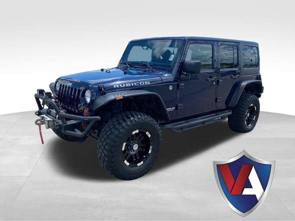Used 2013 Jeep Wrangler Unlimited Rubicon w/ Dual Top Group AWD/4WD image 1