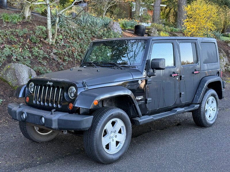 Used 2012 Jeep Wrangler Unlimited Sahara AWD/4WD image 1