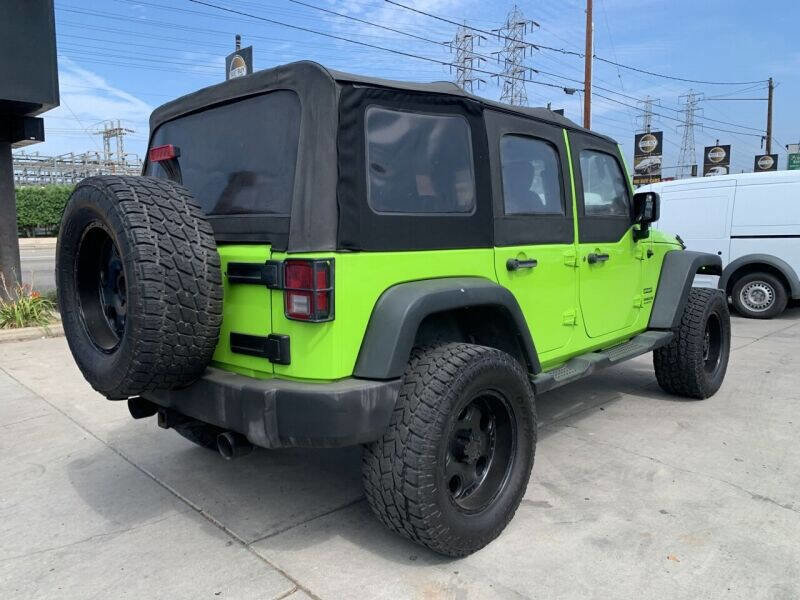 Used 2013 Jeep Wrangler Unlimited Sport w/ Mopar Black Appearance Group image 8