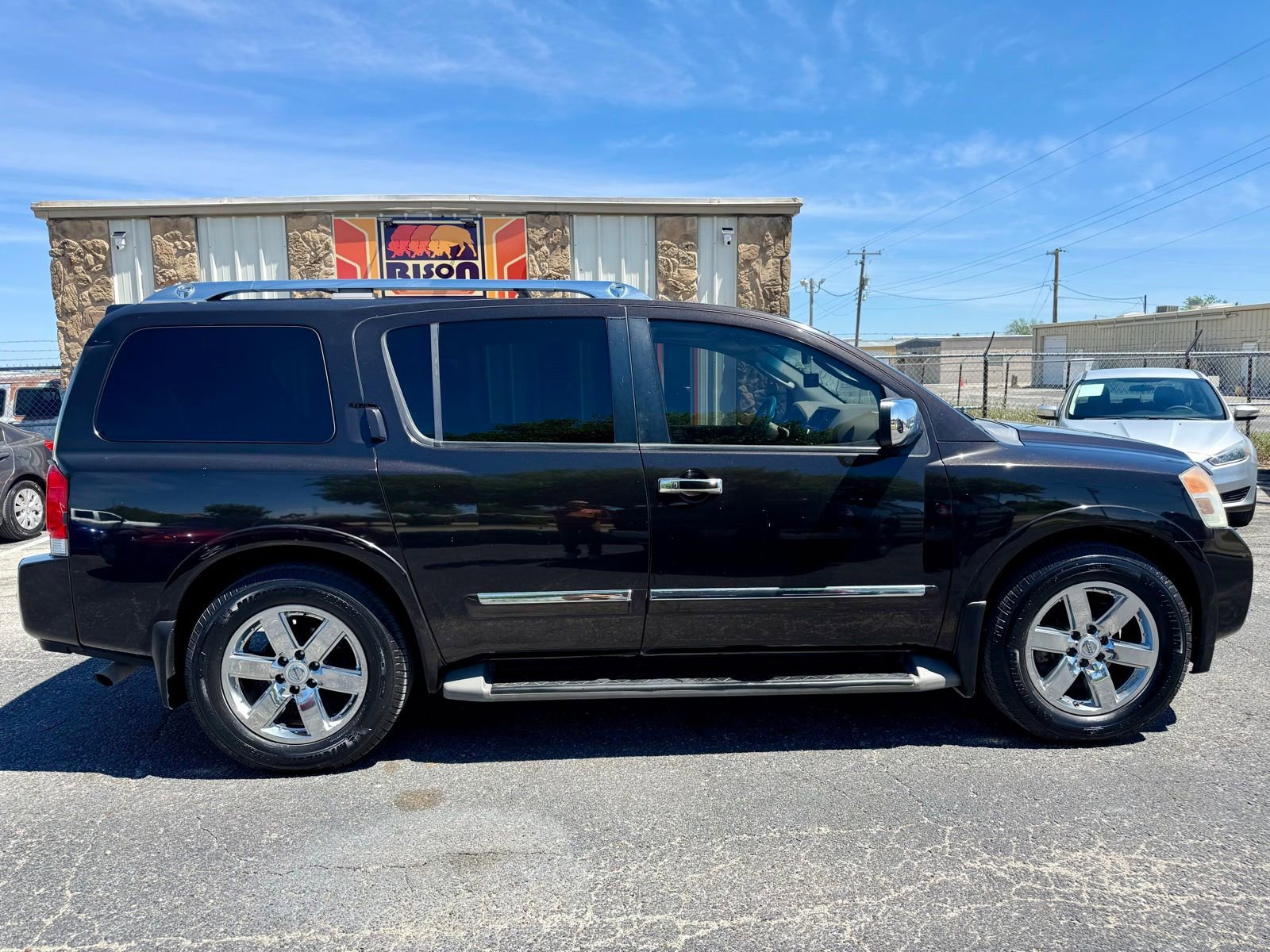 Used 2011 Nissan Armada Platinum w/ 2nd Row Captain Seat Pkg image 2