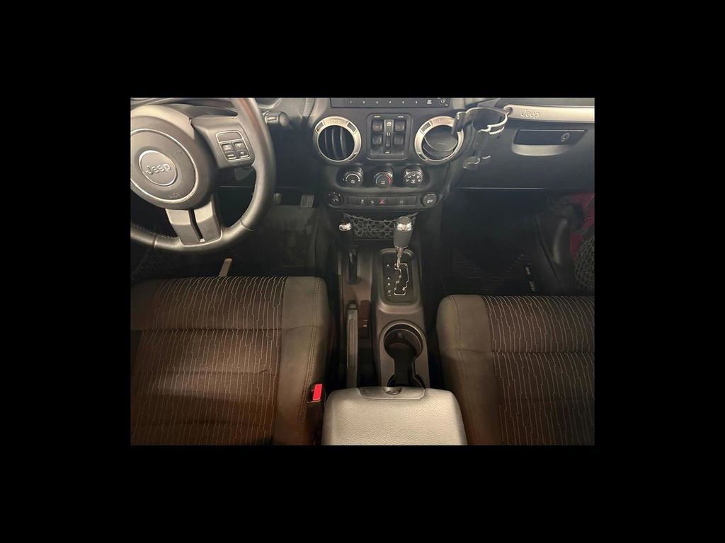Used 2012 Jeep Wrangler Unlimited Sahara w/ Dual Top Group AWD/4WD image 16