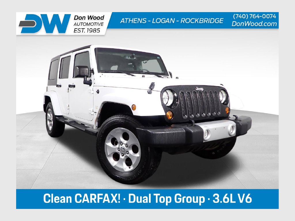 Used 2013 Jeep Wrangler Unlimited Sahara w/ Dual Top Group AWD/4WD image 1