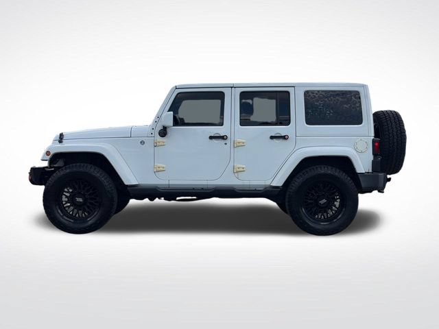 Used 2014 Jeep Wrangler Unlimited Sahara w/ Dual Top Group AWD/4WD image 17