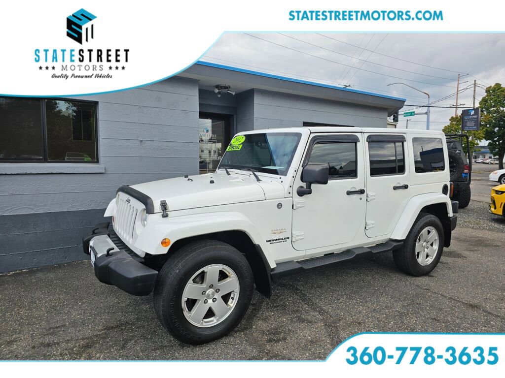 Used 2012 Jeep Wrangler Unlimited Sahara w/ Dual Top Group AWD/4WD image 1