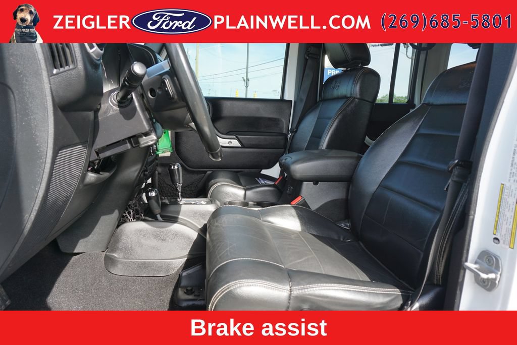 Used 2012 Jeep Wrangler Unlimited Sahara w/ Dual Top Group AWD/4WD image 16