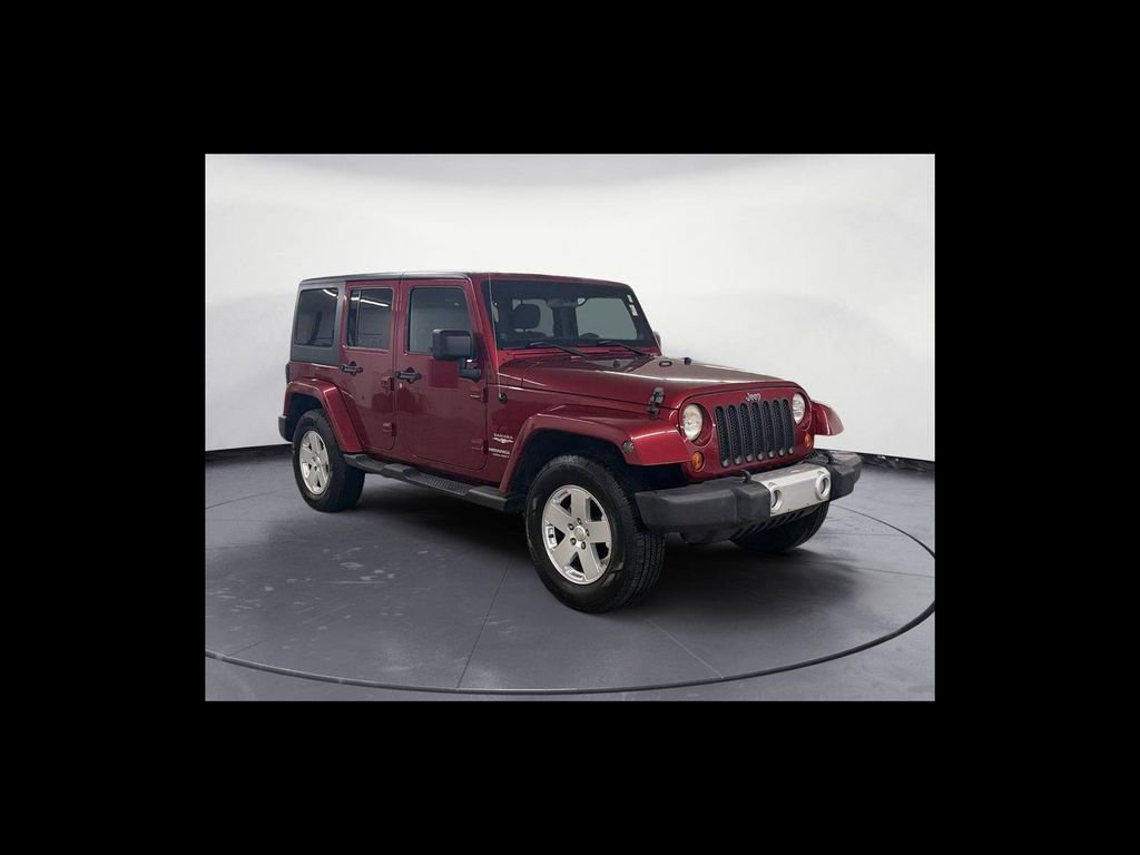 Used 2012 Jeep Wrangler Unlimited Sahara w/ Dual Top Group AWD/4WD image 8