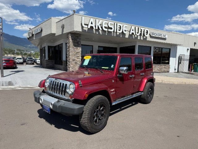 Used 2011 Jeep Wrangler Unlimited Sahara w/ Dual Top Group AWD/4WD image 1