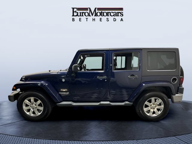 Used 2013 Jeep Wrangler Unlimited Sahara w/ Dual Top Group AWD/4WD image 2