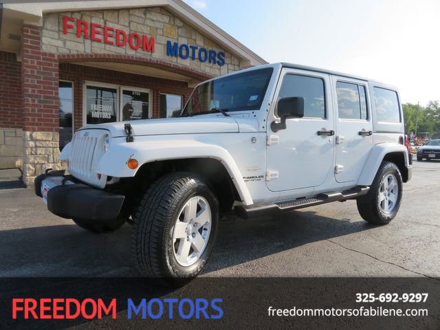 Used 2010 Jeep Wrangler Unlimited Sahara w/ Dual Top Group AWD/4WD image 1