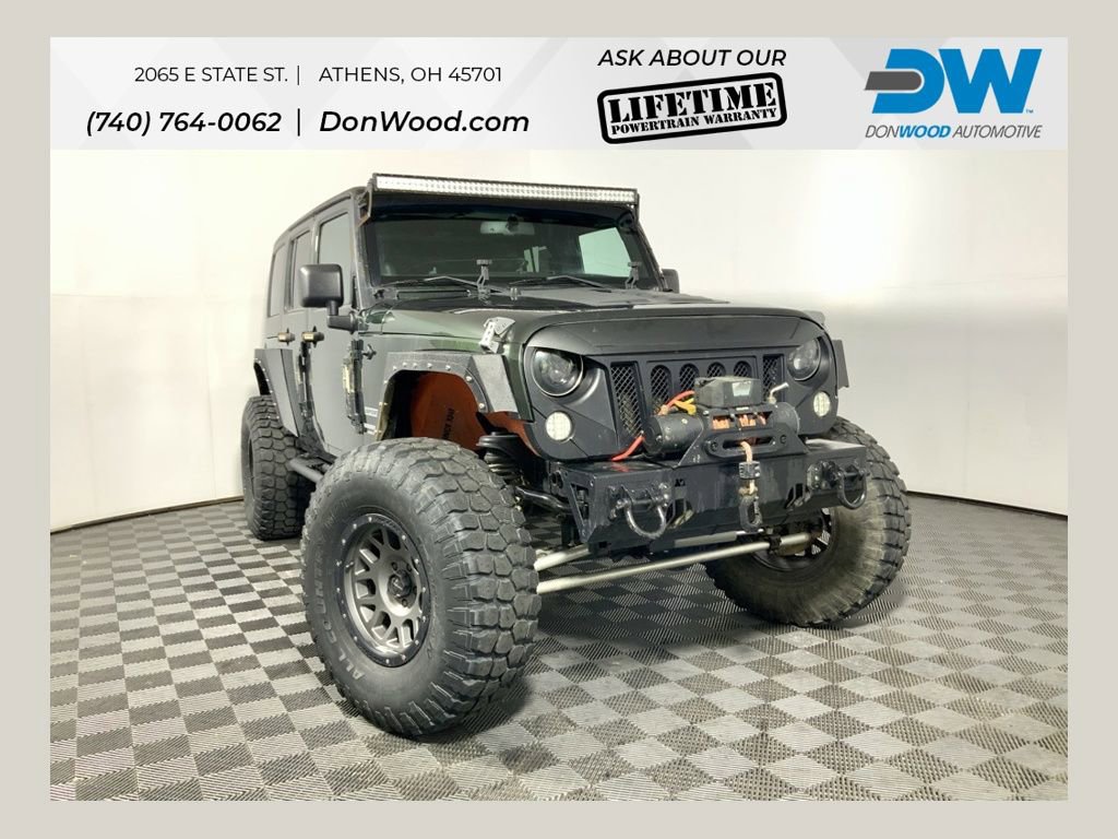 Used 2011 Jeep Wrangler Unlimited Sport image 1