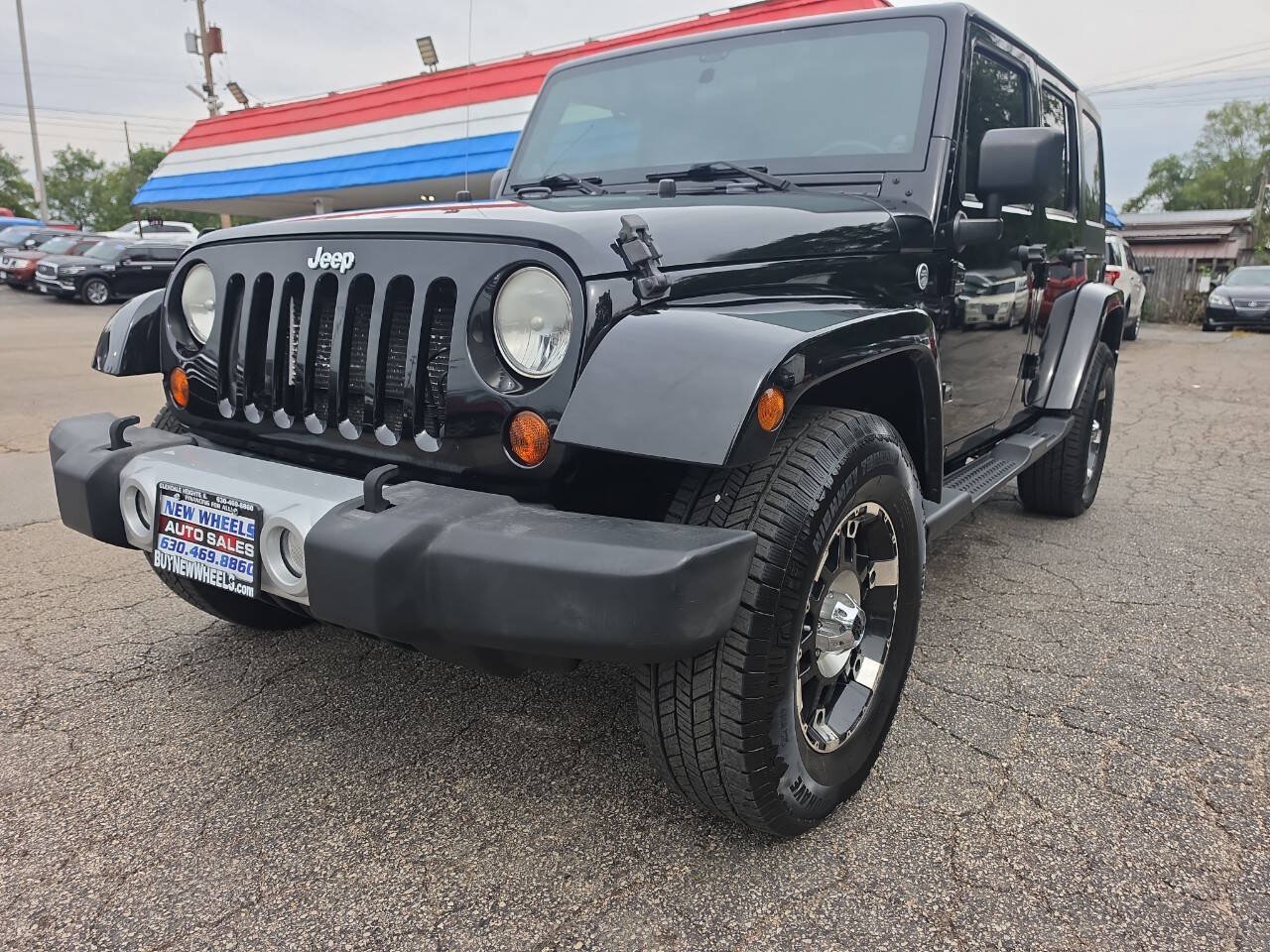 Used 2012 Jeep Wrangler Unlimited Sahara w/ Connectivity Group AWD/4WD image 1