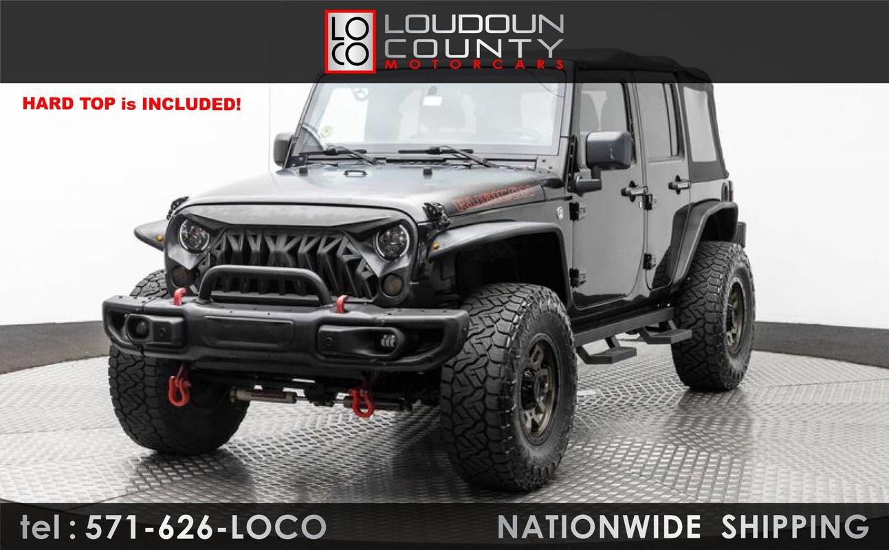 Used 2012 Jeep Wrangler Unlimited Rubicon w/ Dual Top Group AWD/4WD image 1