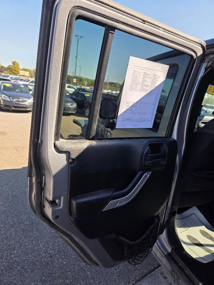 Used 2014 Jeep Wrangler Unlimited Sahara w/ Dual Top Group AWD/4WD image 12