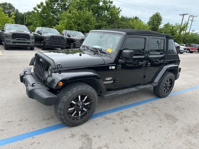 Used 2012 Jeep Wrangler Unlimited Sahara w/ Dual Top Group AWD/4WD image 11
