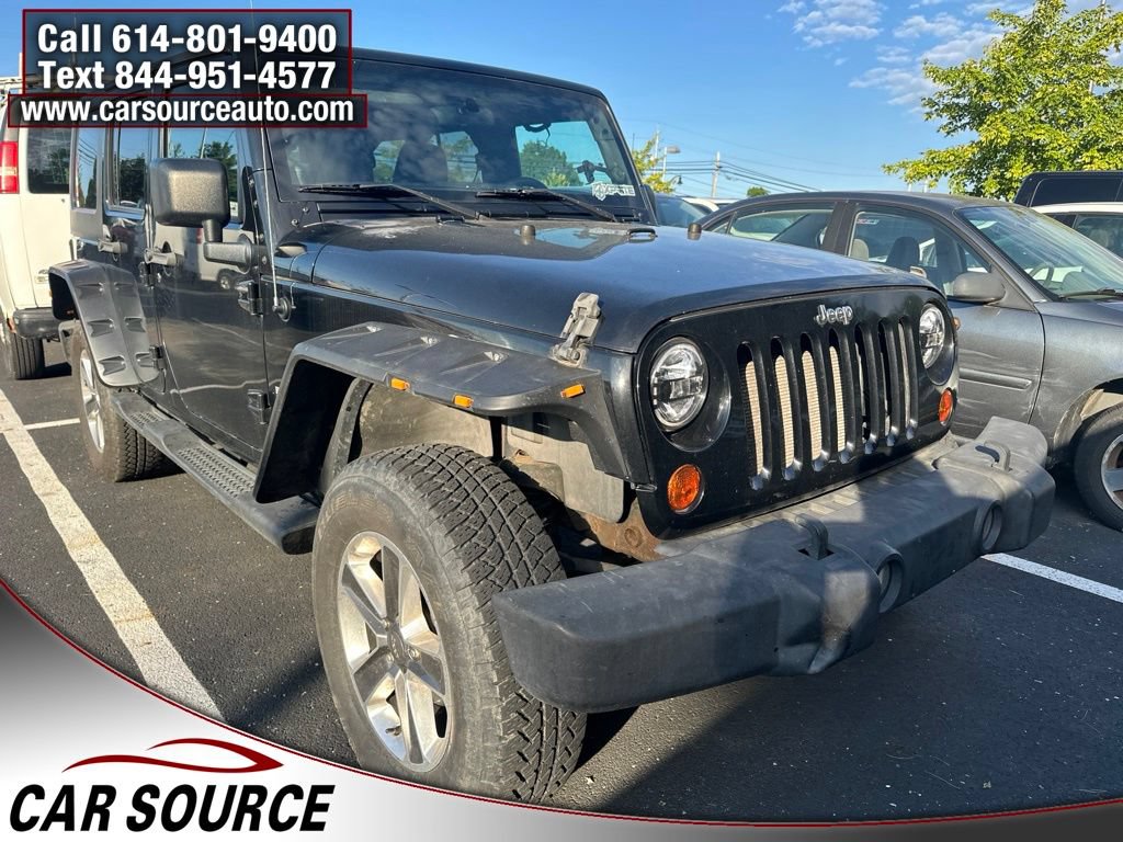 Used 2011 Jeep Wrangler Unlimited Sport AWD/4WD image 1