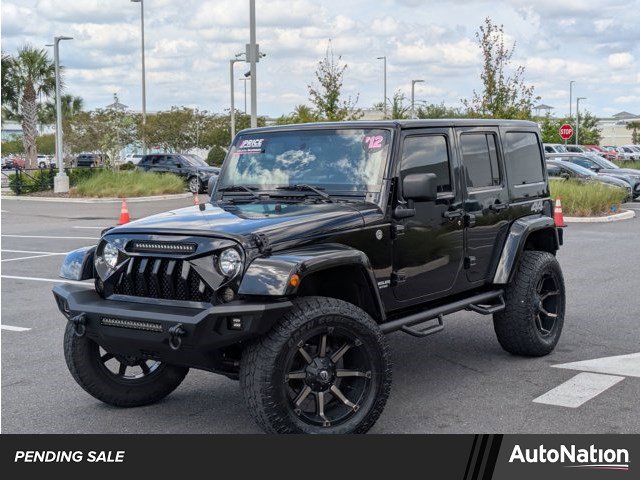 Used 2012 Jeep Wrangler Unlimited Sahara AWD/4WD image 1