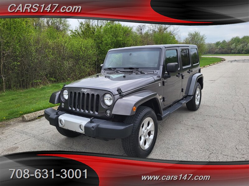 Used 2014 Jeep Wrangler Unlimited Sahara w/ Dual Top Group AWD/4WD image 1