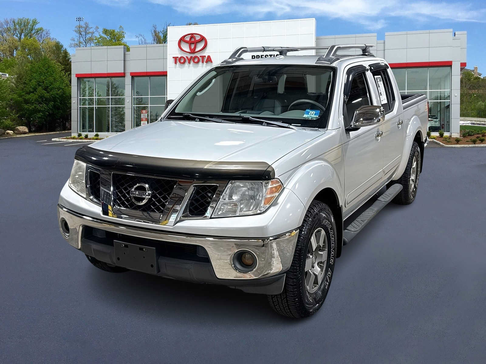 Used 2010 Nissan Frontier LE w/ LE Value Truck Pkg AWD/4WD image 1