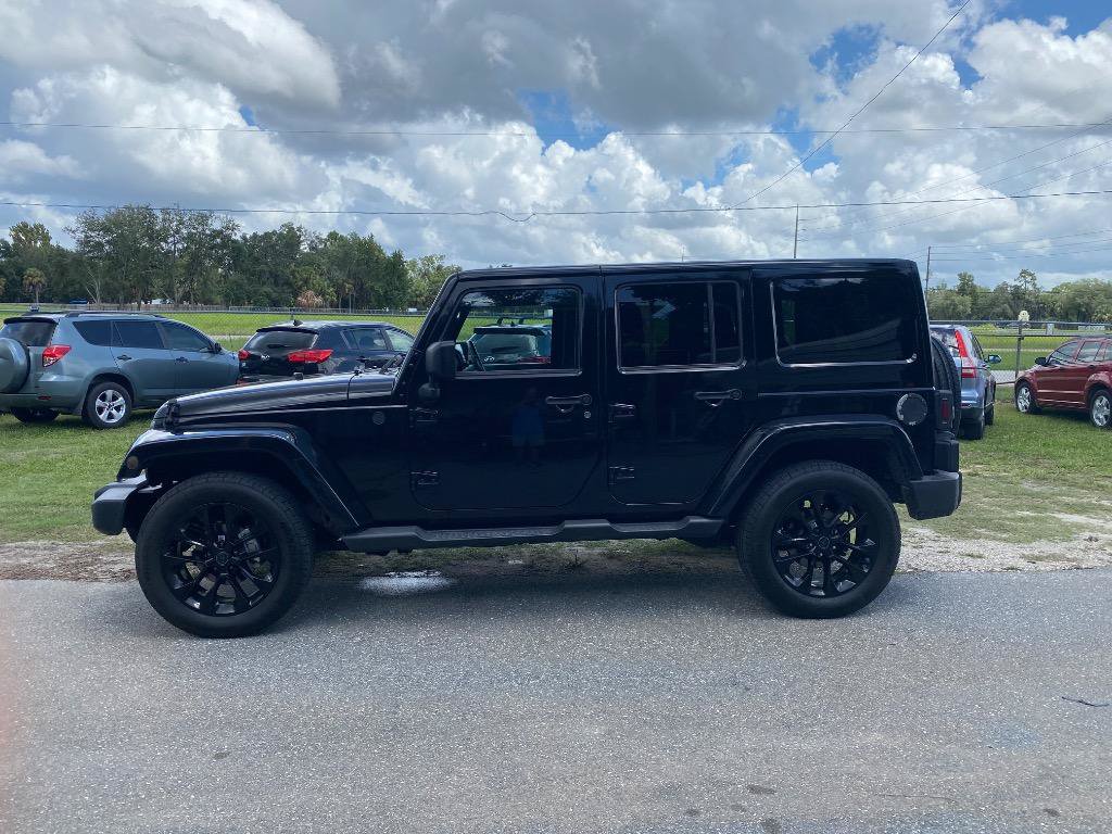Used 2012 Jeep Wrangler Unlimited Sahara w/ Dual Top Group AWD/4WD image 1