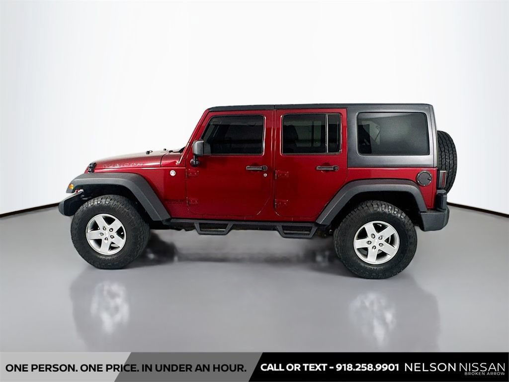 Used 2012 Jeep Wrangler Unlimited Rubicon w/ Dual Top Group AWD/4WD image 8