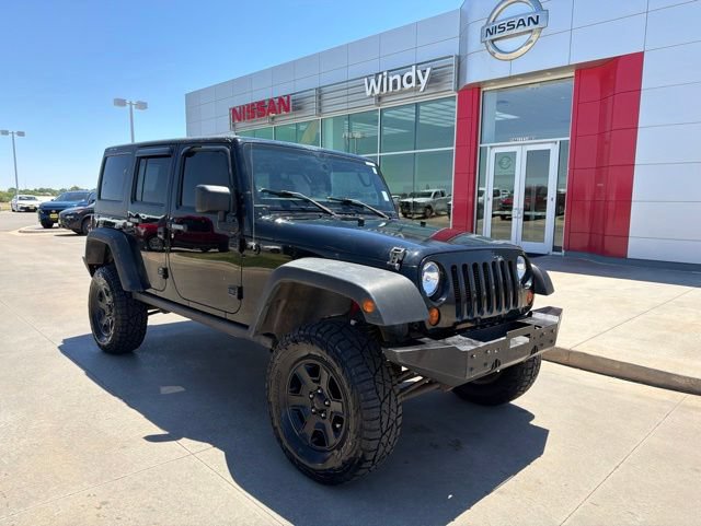Used 2012 Jeep Wrangler Unlimited Rubicon w/ Dual Top Group AWD/4WD image 1