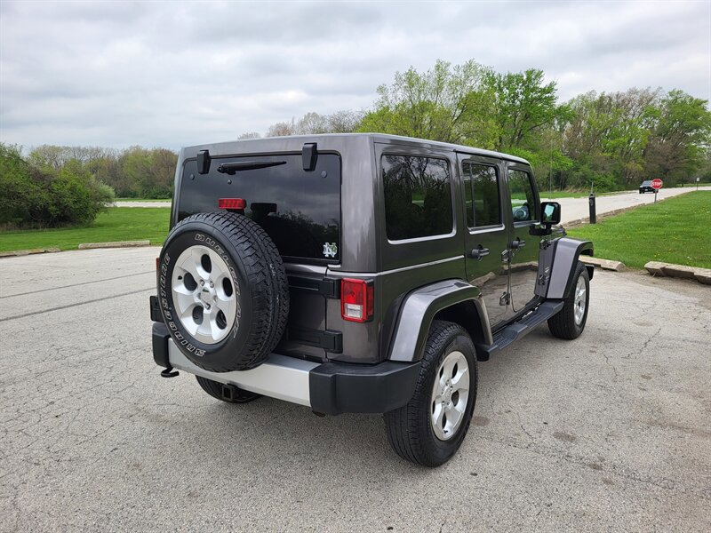 Used 2014 Jeep Wrangler Unlimited Sahara w/ Dual Top Group AWD/4WD image 7