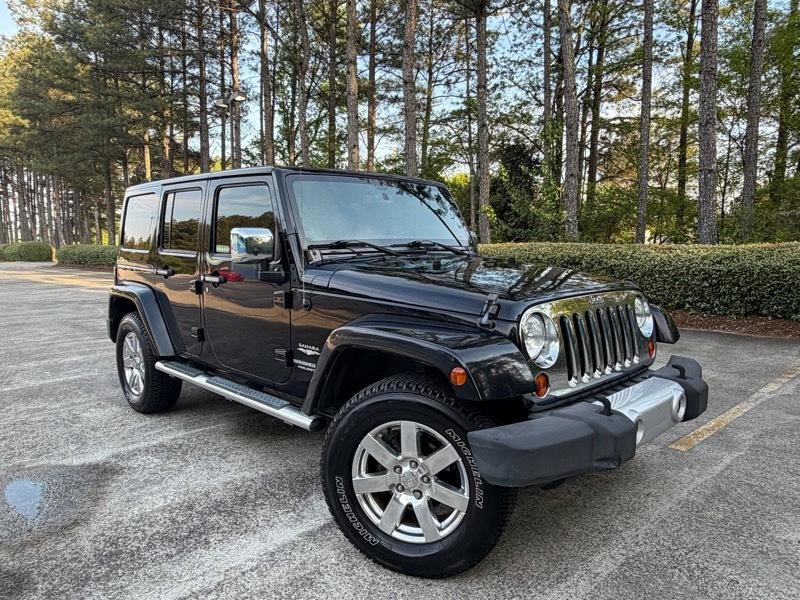 Used 2013 Jeep Wrangler Unlimited Sahara w/ Dual Top Group AWD/4WD image 14