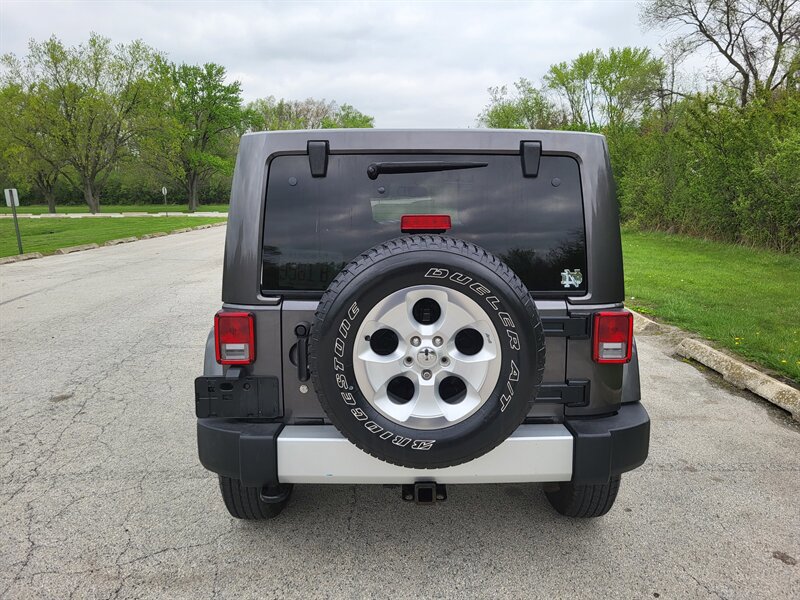 Used 2014 Jeep Wrangler Unlimited Sahara w/ Dual Top Group AWD/4WD image 8