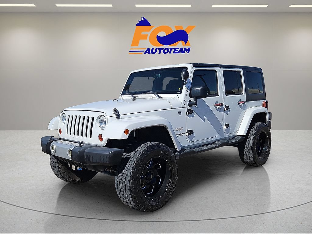 Used 2013 Jeep Wrangler Unlimited Sahara w/ Dual Top Group AWD/4WD image 1