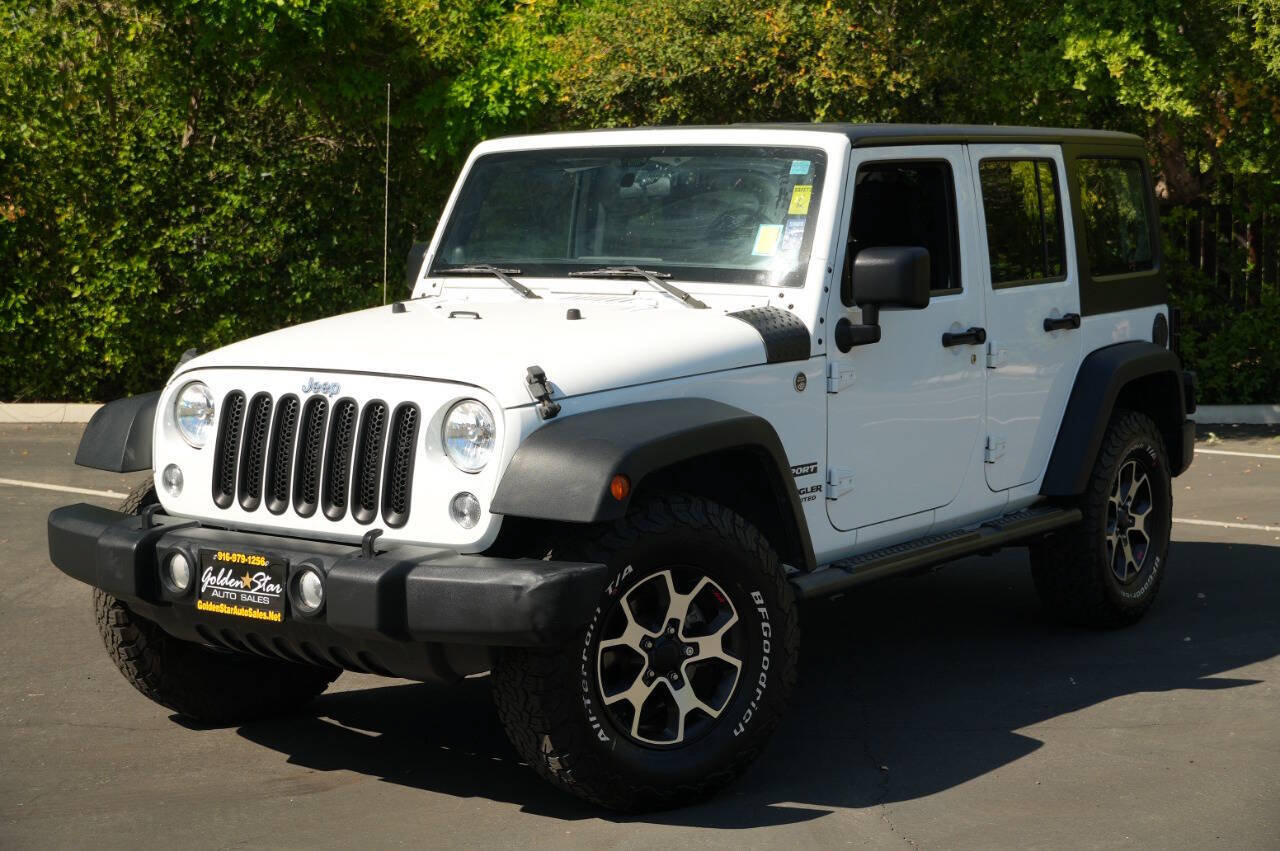 Used 2014 Jeep Wrangler Unlimited Sport w/ Mopar Black Appearance Group AWD/4WD image 1