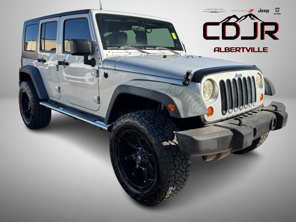 Used 2011 Jeep Wrangler Unlimited Sport AWD/4WD image 1