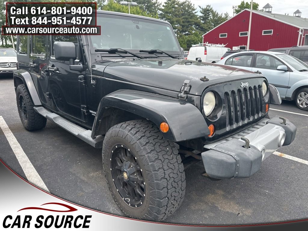 Used 2011 Jeep Wrangler Unlimited Sahara w/ Dual Top Group AWD/4WD image 1
