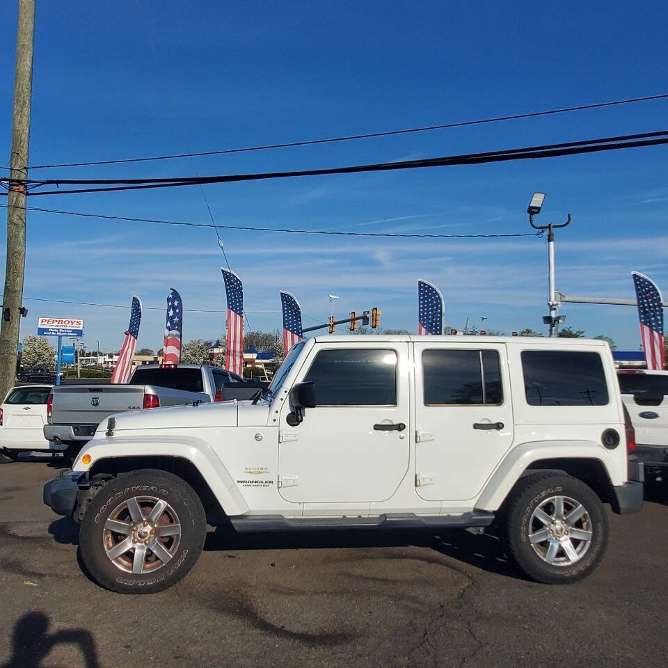 Used 2015 Jeep Wrangler Unlimited Sahara w/ Dual Top Group AWD/4WD image 2