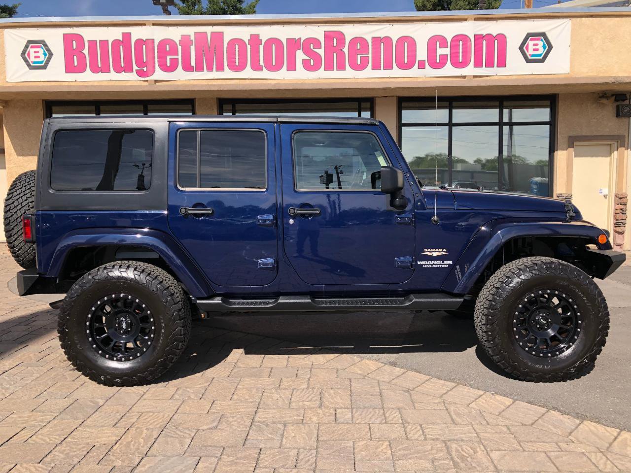 Used 2013 Jeep Wrangler Unlimited Sahara w/ Trailer Tow Group AWD/4WD image 1