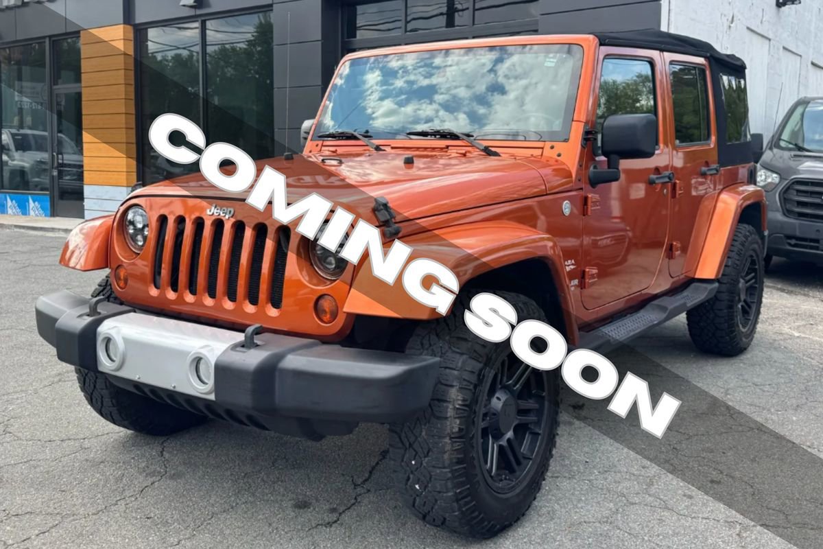 Used 2010 Jeep Wrangler Unlimited Sahara w/ Dual Top Group AWD/4WD image 1