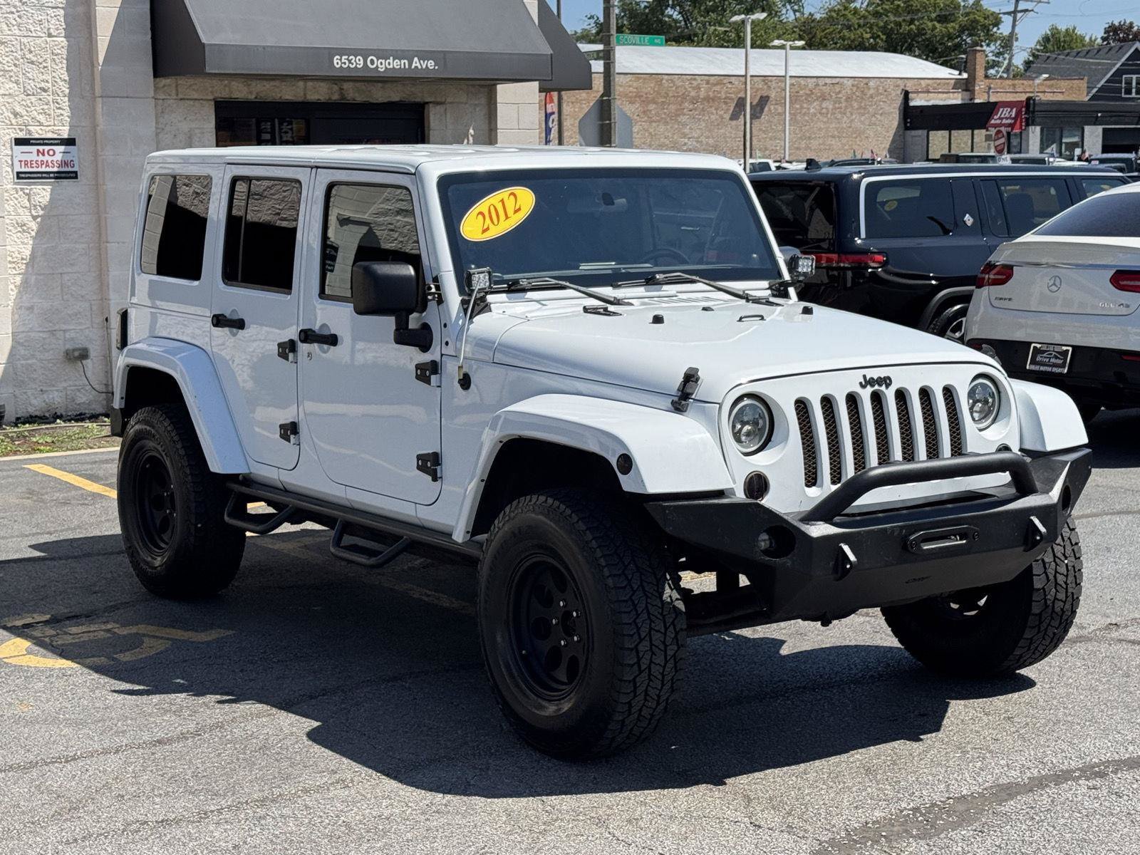 Used 2012 Jeep Wrangler Unlimited Sahara w/ Dual Top Group AWD/4WD image 13