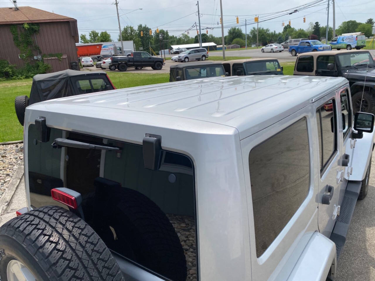 Used 2012 Jeep Wrangler Unlimited Sahara w/ Dual Top Group AWD/4WD image 46