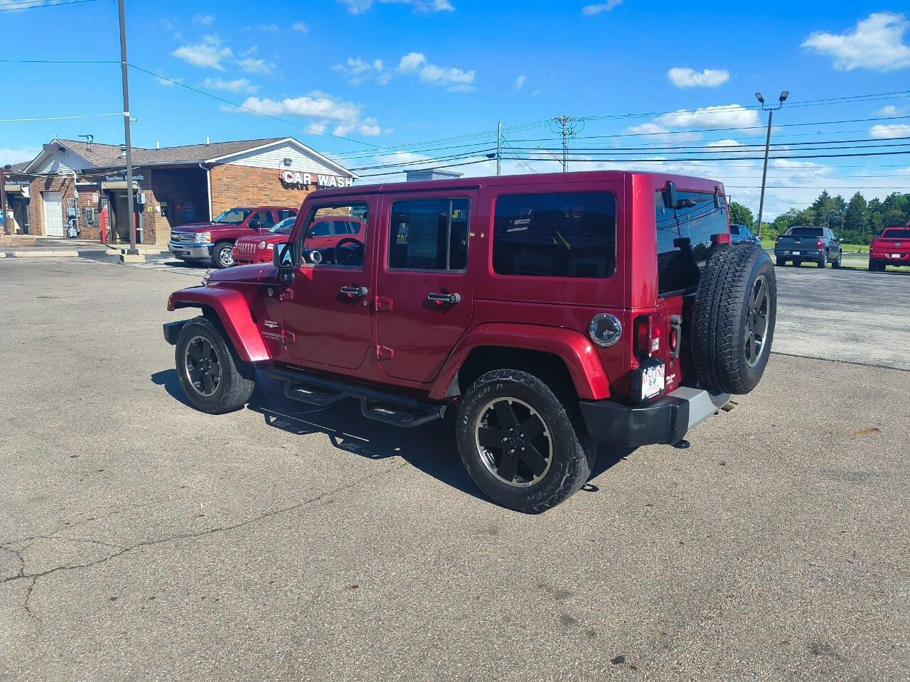 Used 2011 Jeep Wrangler Unlimited Sahara w/ Dual Top Group AWD/4WD image 9