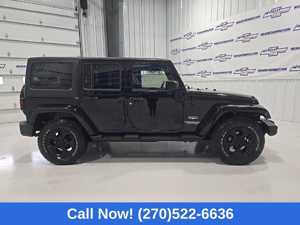 Used 2012 Jeep Wrangler Unlimited Sahara w/ Dual Top Group AWD/4WD image 9