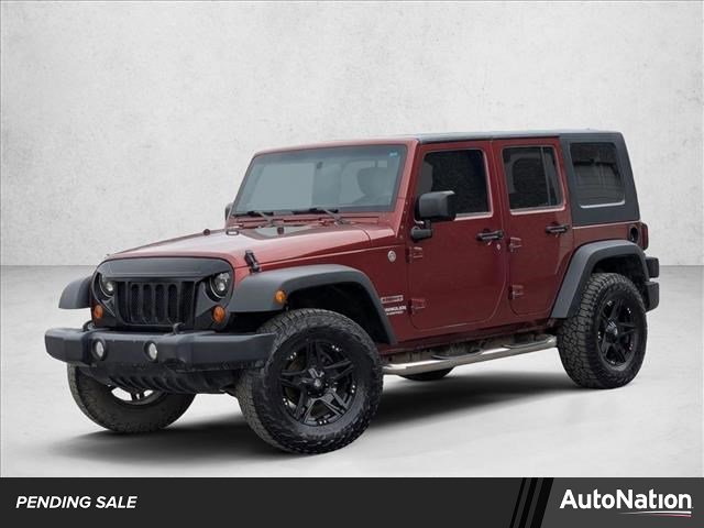 Used 2010 Jeep Wrangler Unlimited Sport w/ Trailer Tow Group AWD/4WD image 1