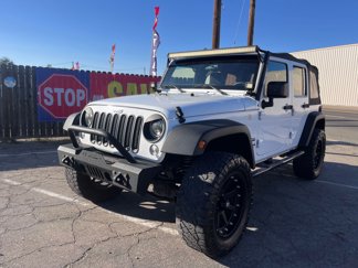 Used 2016 Jeep Wrangler Unlimited Sport image 1
