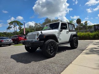 Used 2013 Jeep Wrangler Sport w/ Mopar Black Appearance Group image 1