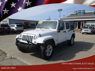 Used 2014 Jeep Wrangler Unlimited Sahara w/ Dual Top Group image 1