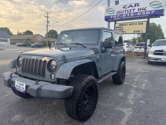 Used 2015 Jeep Wrangler Sport w/ Mopar Black Appearance Group image 1