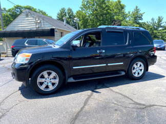 Used 2011 Nissan Armada Platinum w/ 2nd Row Captain Seat Pkg image 1