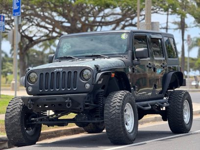 Used 2013 Jeep Wrangler Unlimited Sport w/ Mopar Black Appearance Group